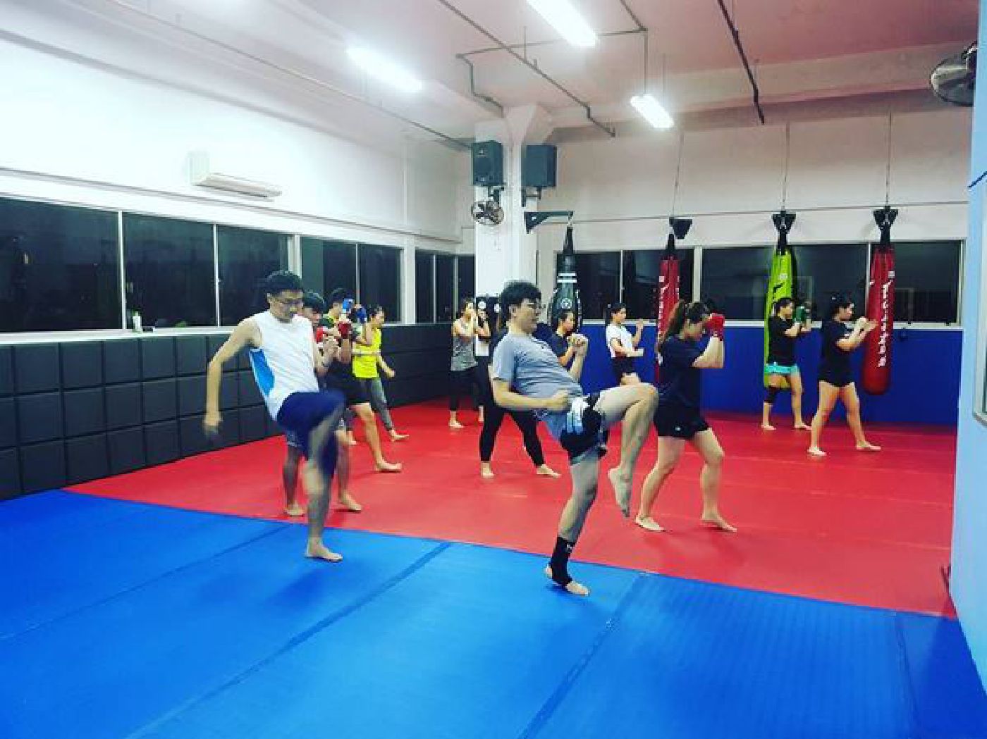 Muay Thai Singapore West students working on their Muay Thai kneeing techniques
